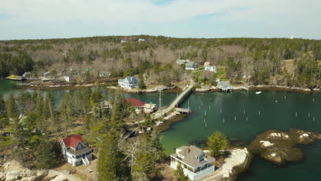 scenic aerial of maine coastal village with beautiful green water on a sunny day