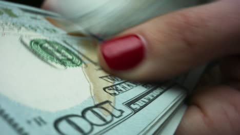 businesswoman hands holding us money banknotes of new 100 dollars