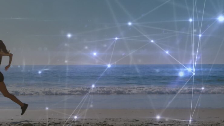 Animación de redes de conexiones sobre una mujer caucásica corriendo en la playa