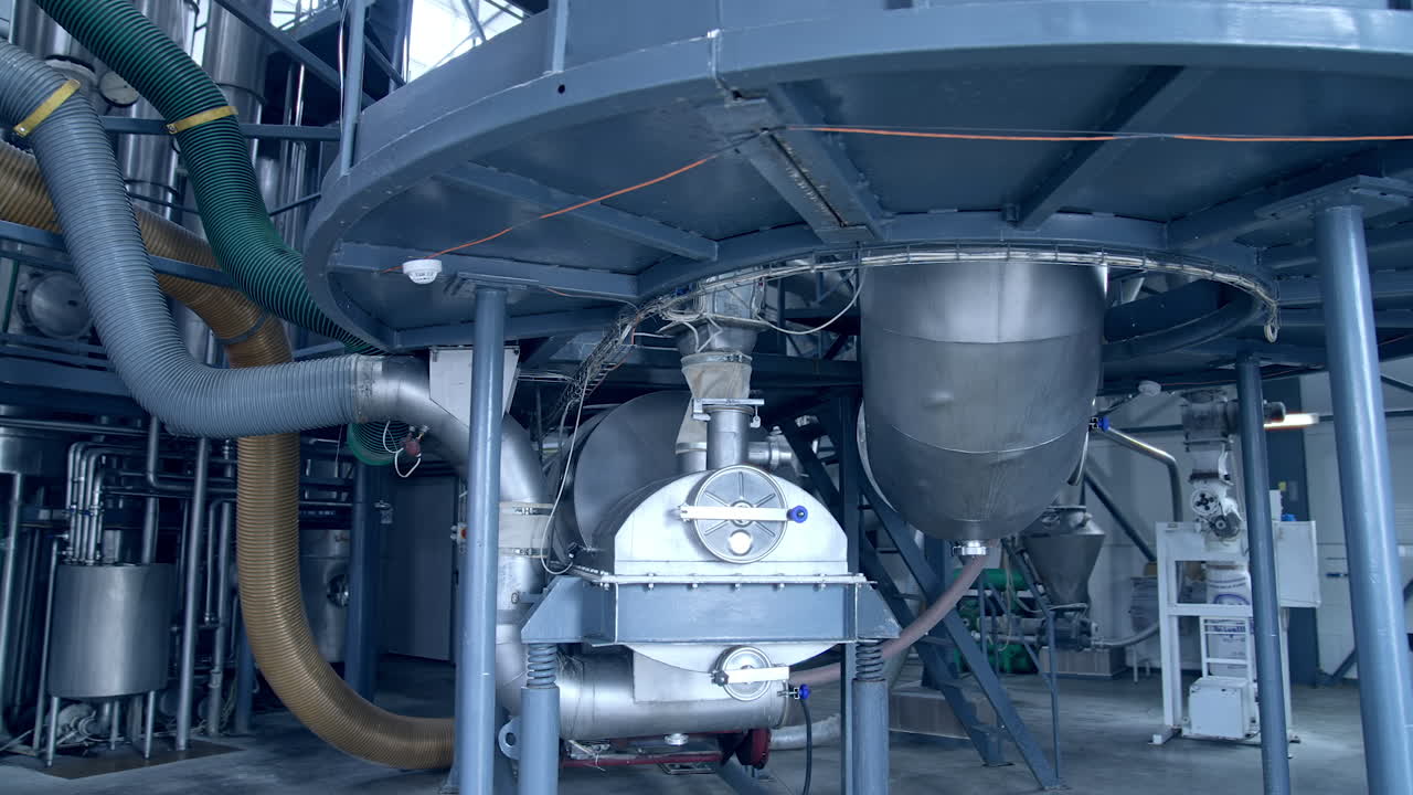 Modern food pipelines technology. Big steel construction of milk factory.