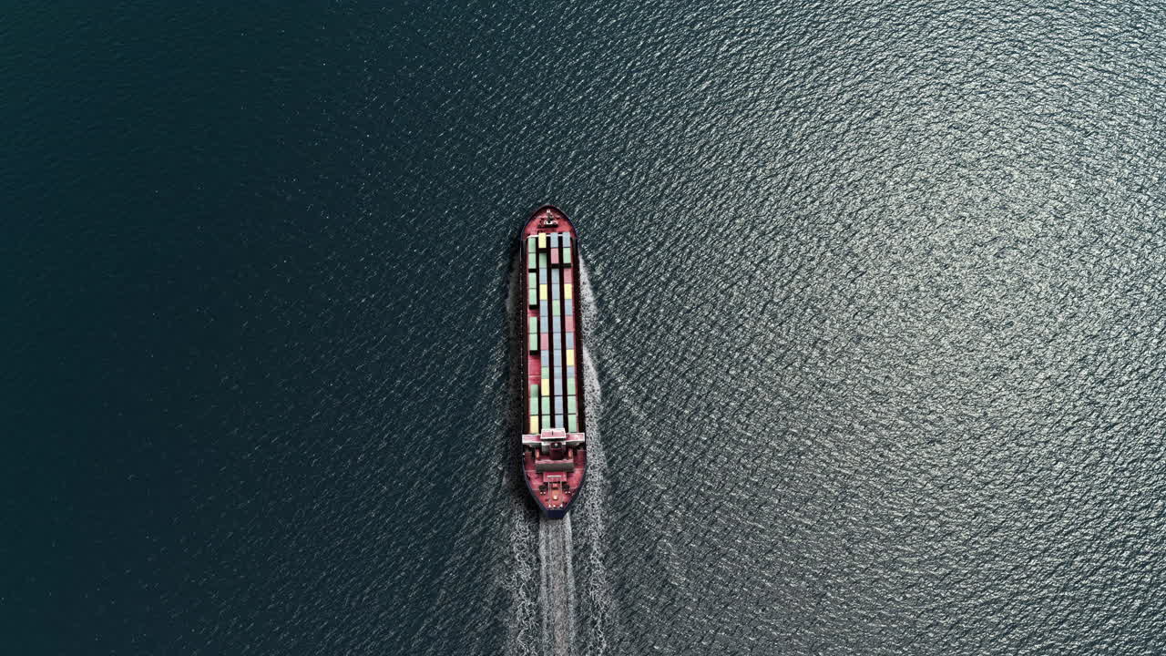 Aerial View of a Cargo Ship Navigating the Ocean