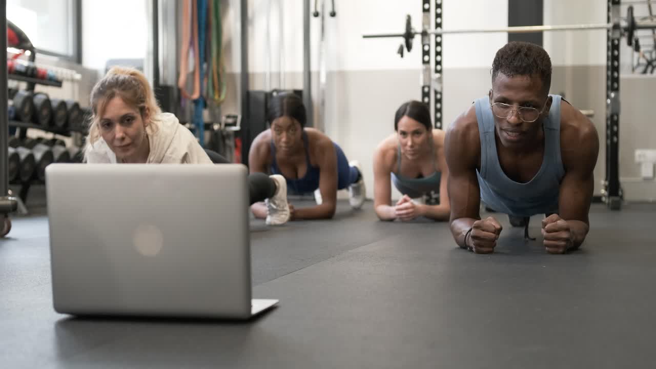Group Plank Workout Following Online Instructions