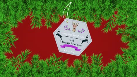 animación de felicitaciones de navidad en etiqueta sobre ramas de abeto sobre fondo rojo