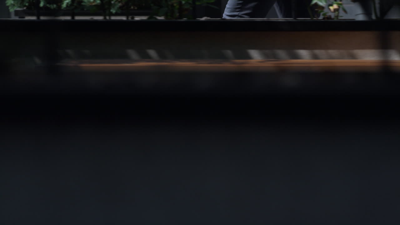 Closeup businessman legs running to office in morning. Confident manager rushing