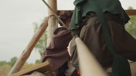 warriors in medieval clothes stand on street talking calmly