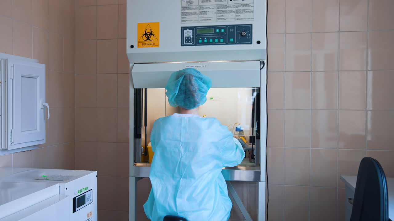 Female scientist working in laboratory. Medical researcher working in modern hospital laboratory