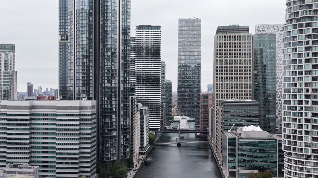 Reverse drone,aerial Canary Wharf Isle of Dogs London residential apartments