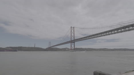 timelapse of the red bridge over the water in lisbon portugal log