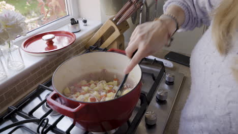 cooking potatoes and ham on the stovetop