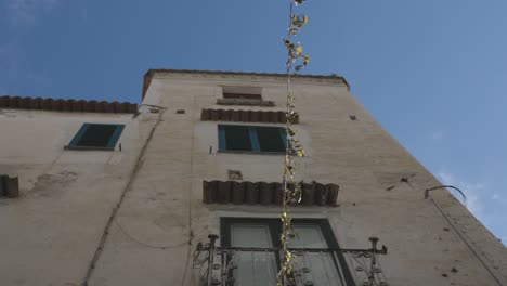 amalfi italy looking up between two buildings