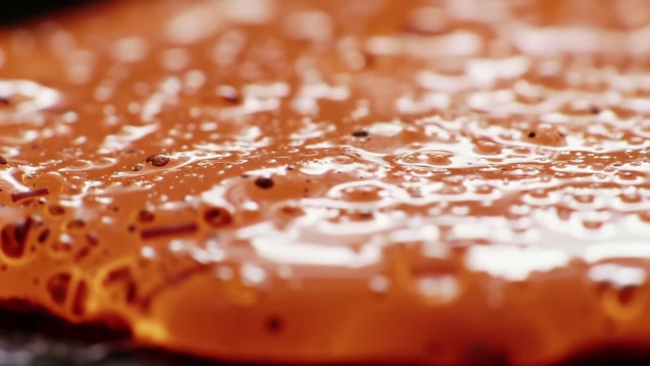 Viscous Liquid Flows Slowly on the Surface, Creating Mesmerizing Patterns in a Vibrant Orange Hue