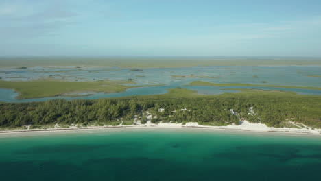 Beautiful-Caribbean-waters-alongside-white-sand-beaches-and-freshwater-inlets-dotting-the-landscape-in-Tulum,-Mexico