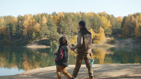 father and son fishing in autumn