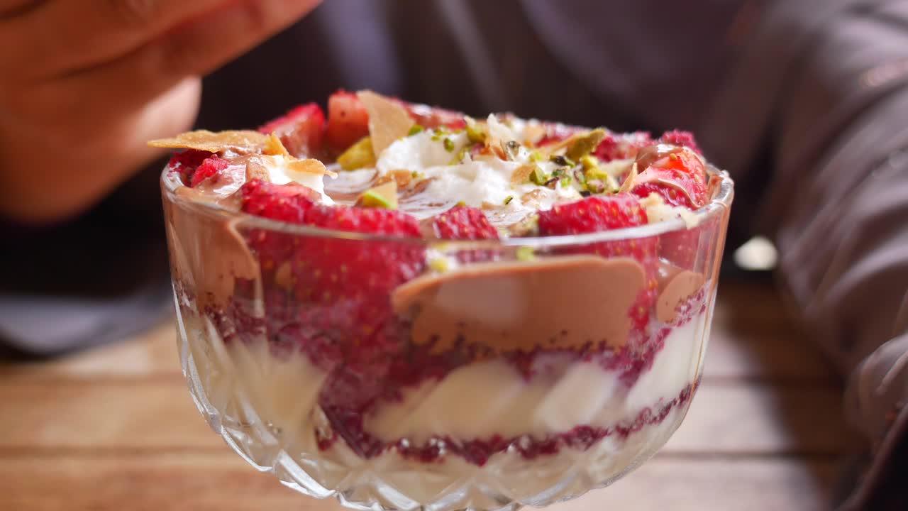 Dessert bowl with strawberries, cream and chocolate