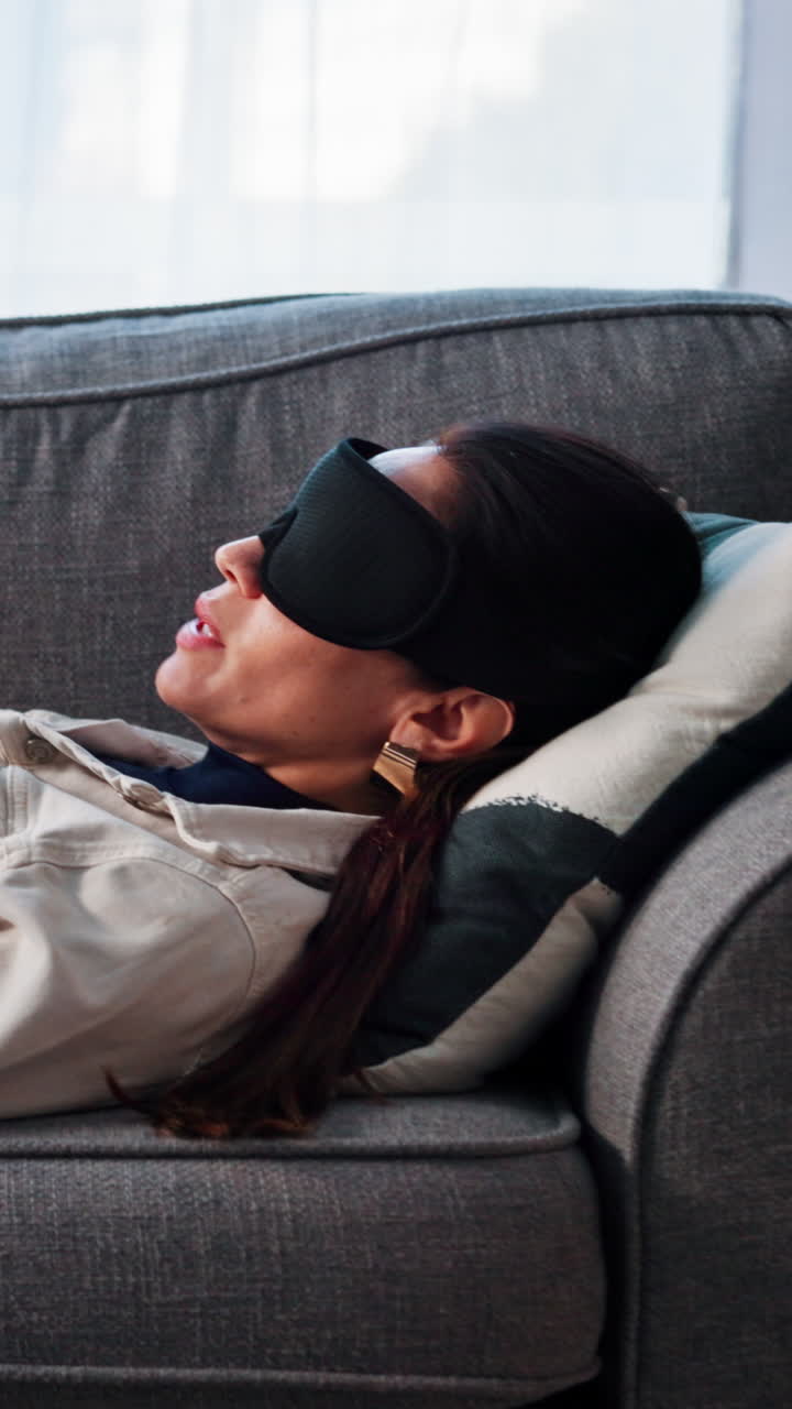 Woman Sleeping on Couch with Sleep Mask