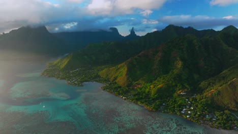 aerial view of tropical island bay with lush mountains
