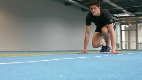 Man-racing-on-indoor-track