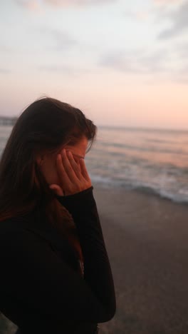 woman on the beach at sunset