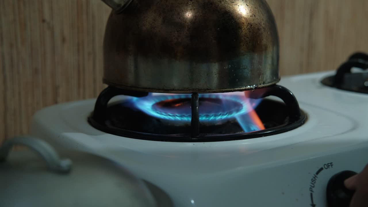 Boiling Water In A Kettle Over The Oven. Close-up Shot