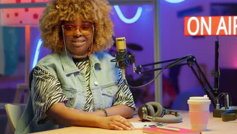 podcast host in a colorful studio