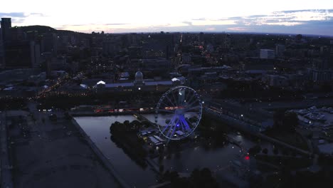 aerial shot of montreal's old port with the ferris wheel in view, showcasing the vibrant waterfront and historic architecture. perfect for capturing the essence of the city.