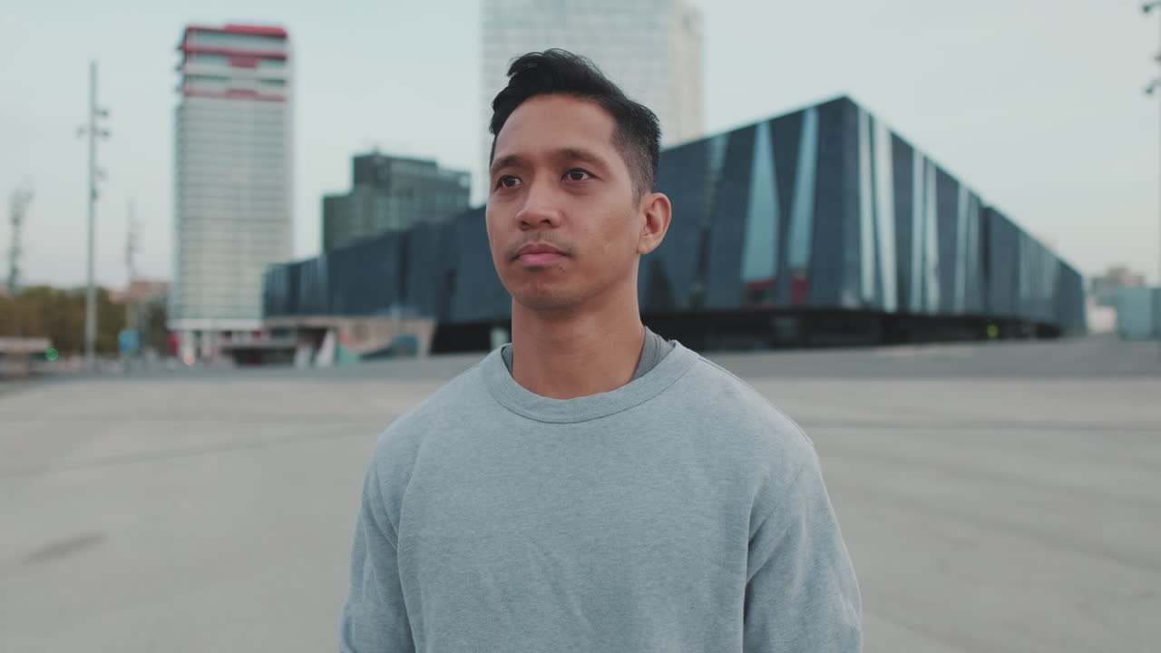 Man posing in an urban environment