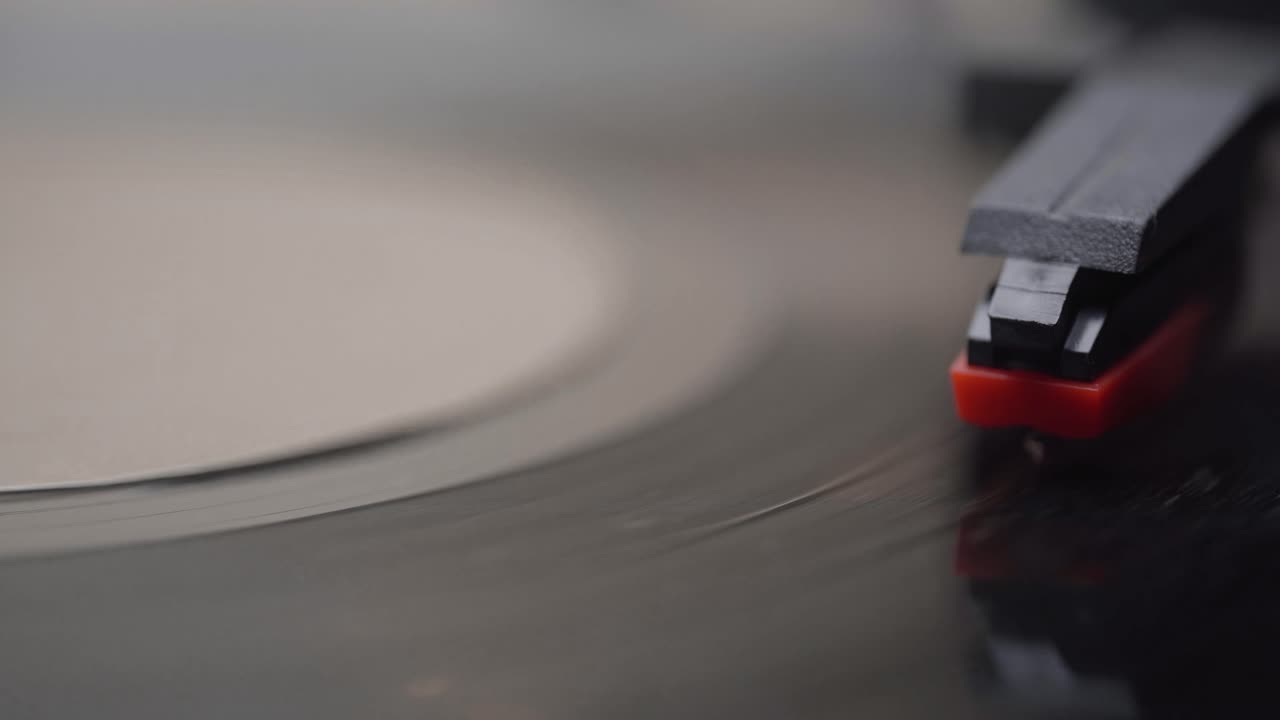 Close-up of Turntable Needle Playing Vinyl Record