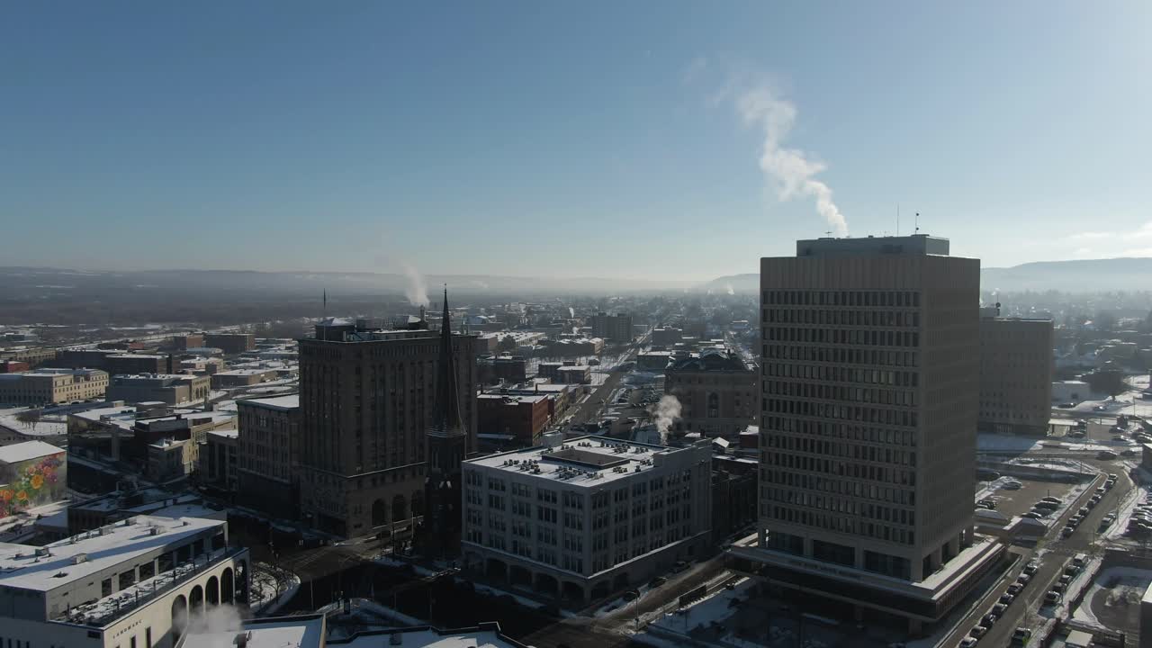 Downtown Utica, NY Aerial Drone on cold winter morning, rising above Genesee Street