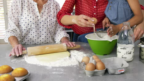 Little-girls,-grandma-and-his-mom-preparing-cake