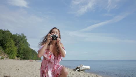 point of view as an attractive young woman takes photos of the viewer