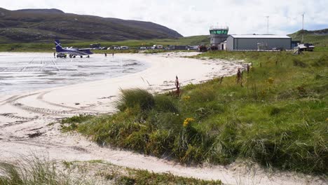 shot of a passenger plane after landing on the beach at barra airport