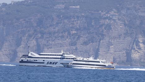 two boats passing near cliffs in naples