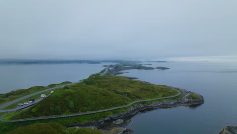 aerial arc shot of atlantic ocean road and storseisundet bridge, norway