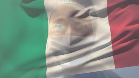 bandera italiana agitando contra la científica que lleva una máscara facial