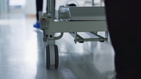 healthcare, doctor and push bed in hospital