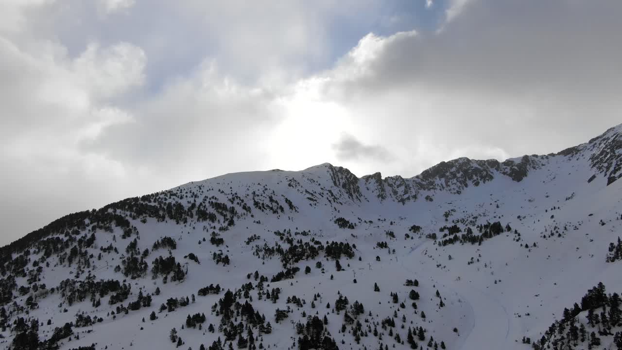 Aerial view of snow-capped mountain range with cloudy sky, Ordino Arcalis, Andorra