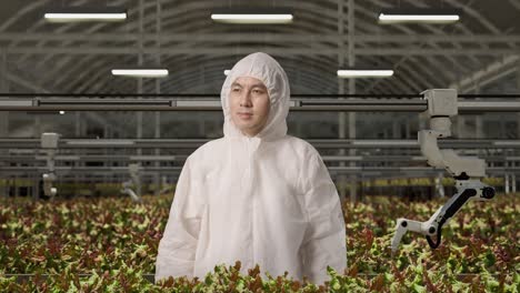 worker in a modern vertical farming facility