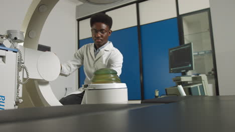 medical professional operating x-ray machine