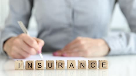 completing insurance form for company reference closeup