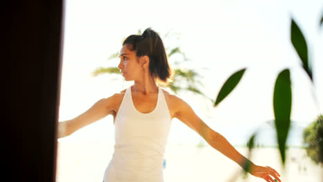 woman exercising in balcony at home 4k