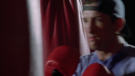 two boxers going over training routines in a gym