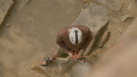 climber at the bottom of the cliff