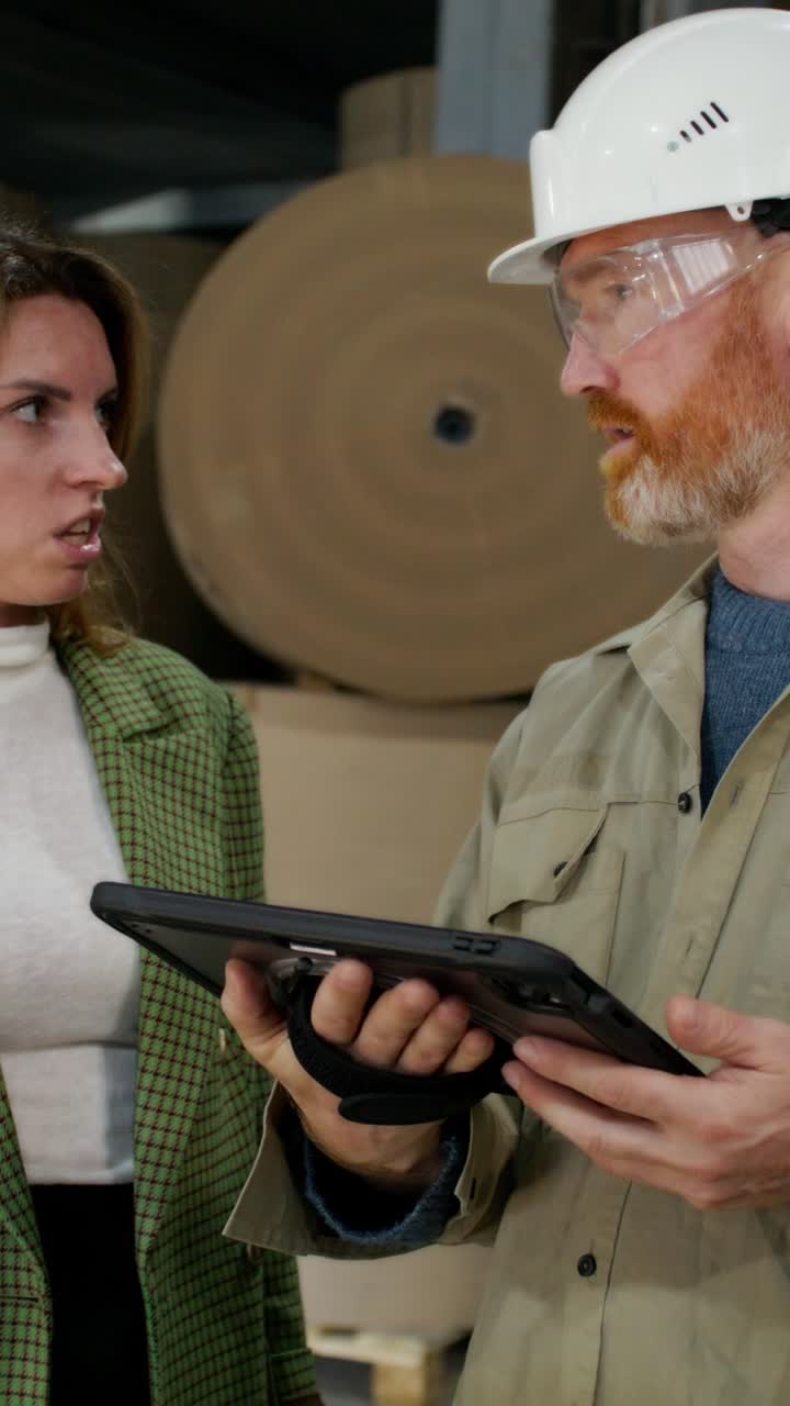 Business Meeting in a Factory Warehouse