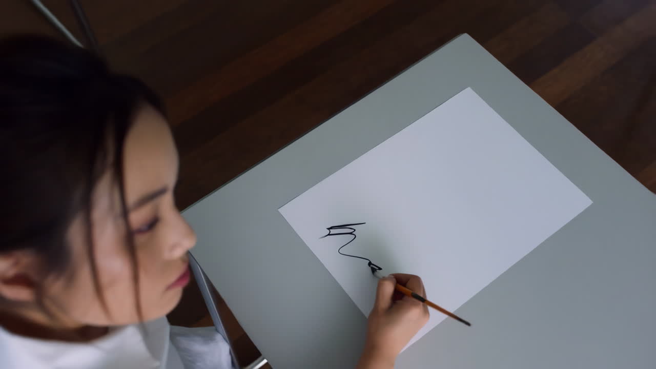 Woman practicing calligraphy or drawing