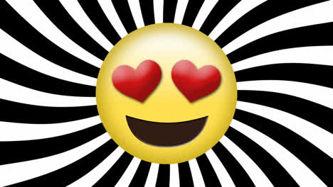 animación del icono emoji con ojos de corazón rojo en rayas blancas y negras girando.