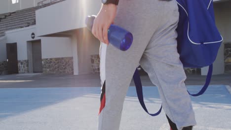 Back-view-of-caucasian-disabled-male-athlete-with-prosthetic-leg-walking