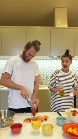 couple cooking together at home