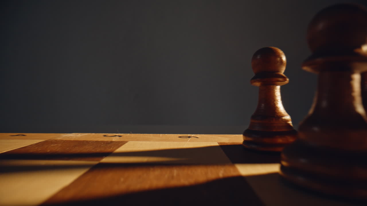 Arm adjusting chess figure sunny place closeup. Enthusiast sliding pawn forward