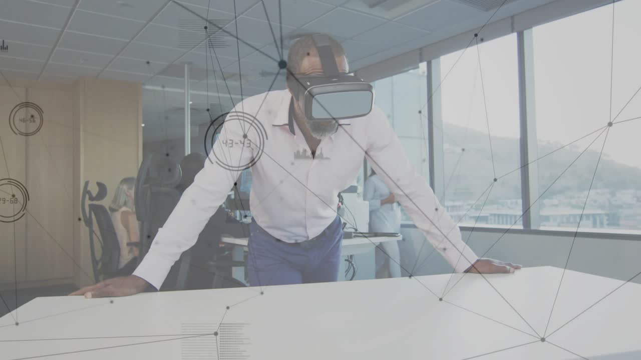 Man securing VR headset leaning on table generating data web for tech insight colleague observing