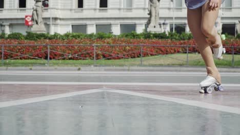 artistic roller skater executing a jump in a slow motion close up shot